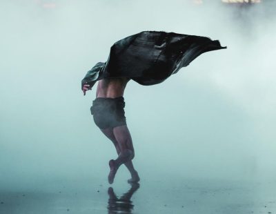 SQ dancer in motion amidst dramatic fog copy